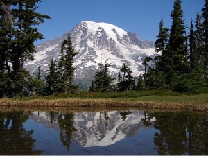 Mt. Rainier reflected in a lake in the nearby Tatoosh Range. Photo from the National Park Service.