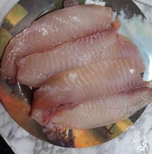 Dab excess water off fish filets before coating